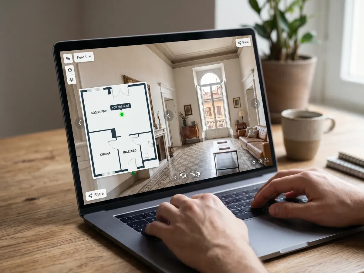 Laptop showing a 3D virtual walkthrough interface of an Italian apartment